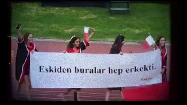 Video Reference: Banner, Advertising, Pink, Grass, Font, Event, Photography, Recreation, Protest, Signage