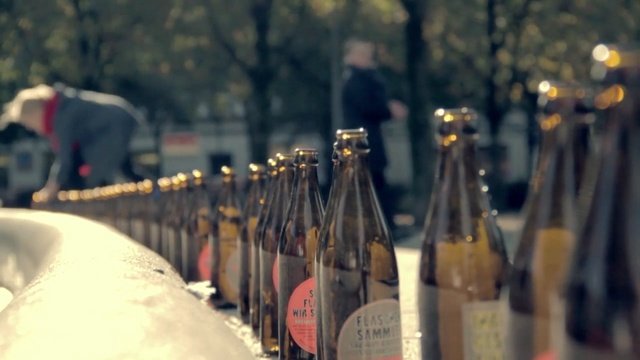 Video Reference: drink, alcoholic beverage, bottle, wine, distilled beverage, alcohol, glass bottle, champagne, Person