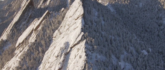 Video Reference: geological phenomenon, rock, ridge, mountain, formation, geology, sky, terrain, winter, arête, Person