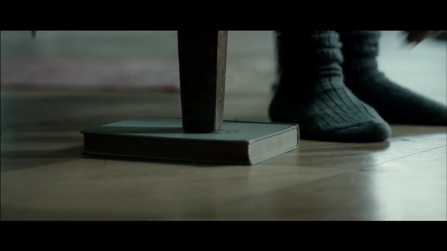 Video Reference: black, footwear, shoe, photography, floor, darkness, leg, foot, shadow, flooring, Person