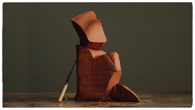 Video Reference: Brown, Sitting, Sculpture, Dress, Headgear, Stock photography, Beige, Art, Photography, Wood