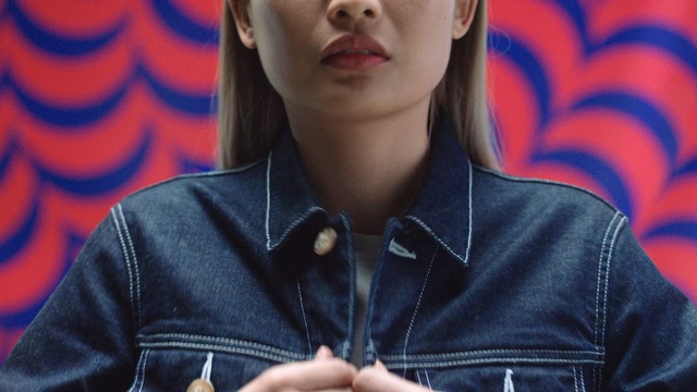 Video Reference: Denim, Jeans, Jacket, Cheek, Textile, Lip, Leather, Outerwear, Leather jacket, Smile, Person