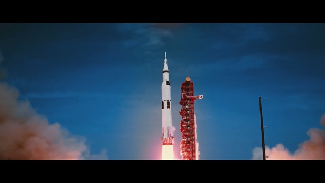 Video Reference: Rocket, Landmark, Tower, Spacecraft, Space shuttle, Sky, Skyscraper, Metropolis, Building, City, Outdoor, Clouds, Cloudy, Dark, Photo, Red, Background, Light, Smoke, View, Air, Blue, Plane, Traffic, Train, White, Airplane, Water, Sign, Stop, Flying, Street, Cloud, Lighthouse, Missile, Day