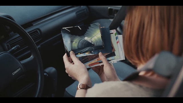 Video Reference: car, steering part, vehicle door, automotive design, steering wheel, motor vehicle, vehicle, driving, hand, seat belt