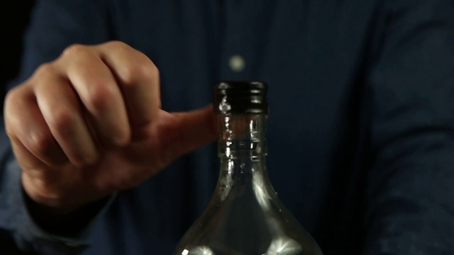 Video Reference: Bottle, Alcohol, Glass bottle, Drinkware, Drink, Wine bottle, Glass, Hand, Finger, Tableware
