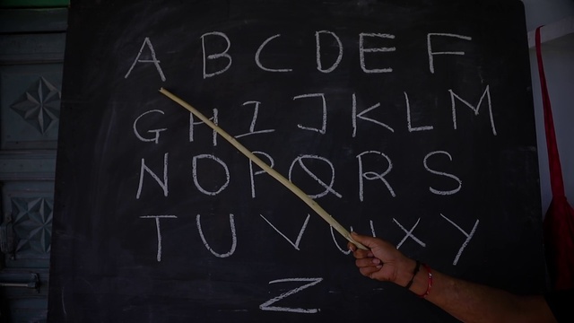 Video Reference: Handwriting, Gesture, Font, Blackboard, Chalk, Wall, Writing, Writing instrument accessory, Room, Slate