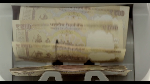 Video Reference: cash, banknote, material, paper, money, font, paper product, Person