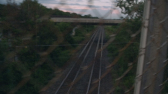 Video Reference: Transport, Atmospheric phenomenon, Track, Tree, Sky, Railway, Train, Vehicle, Thoroughfare, Bridge