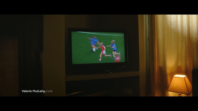 Video Reference: Screen, Display device, Electronics, Media, Technology, Room, Electronic device, Flat panel display, Television, Multimedia, Indoor, Photo, Sitting, Front, Living, Monitor, Flat, Dark, Table, Large, Mounted, Man, Standing, Video, Woman, Playing, Holding, People, Game, Screenshot, Text, Person, Cartoon, Art