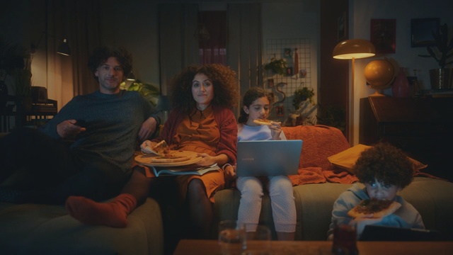 Video Reference: Fun, Sitting, Room, Conversation, Event, Adaptation, House, Table, Vacation, Supper, Person, Indoor, Laptop, Child, Computer, Boy, Young, Looking, Man, Window, Using, Front, Woman, People, Girl, Living, Little, Playing, Group, Holding, Video, Human face, Clothing, Smile, Family