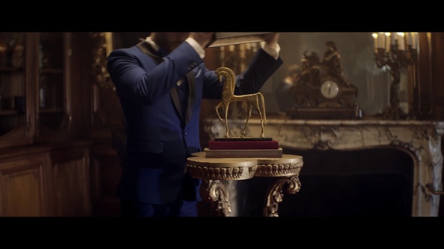 Video Reference: Font, Furniture, Screenshot, Table, Still life photography, Photography, Darkness, Human body, Temple, Sitting