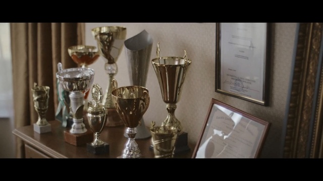 Video Reference: Trophy, Award, Interior design, Table, Glass, Metal, Person