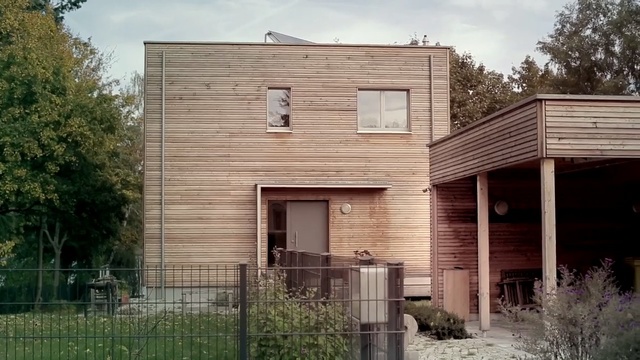 Video Reference: house, property, siding, residential area, home, architecture, real estate, facade, building, cottage, Person