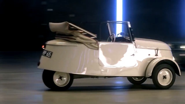 Video Reference: motor vehicle, car, vehicle, golf cart, mode of transport, automotive design, vintage car, automotive exterior, automotive wheel system, Person