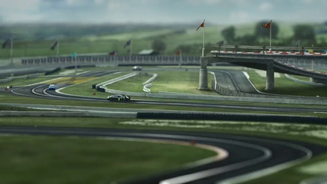 Video Reference: Race track, Sport venue, Road, Thoroughfare, Asphalt, Mode of transport, Lane, Intersection, Freeway, Metropolitan area