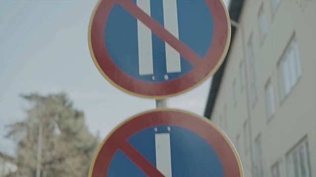 Video Reference: Traffic sign, Sign, Signage, Circle, Street sign, Person