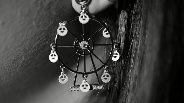 Video Reference: Black, Black-and-white, Monochrome, Fashion accessory, Pendant, Monochrome photography, Still life photography, Jewellery, Necklace, Font, Person
