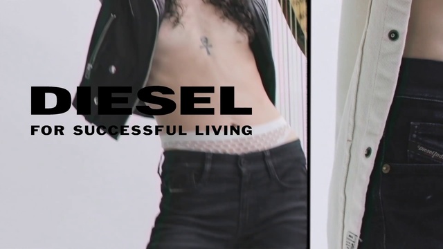 Video Reference: White, Black, Clothing, Male, Waist, Arm, Shoulder, Muscle, Abdomen, Stomach, Person, Holding, Woman, Man, Wearing, Suit, Front, Standing, Shirt, Young, Player, Text, Sleeveless shirt, Undershirt, Trousers