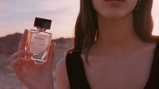 Video Reference: Perfume, Skin, Beauty, Lip, Pink, Neck, Cosmetics, Blond, Gadget, Technology