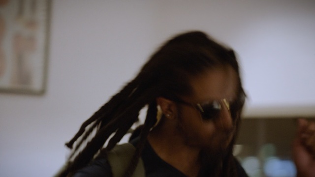 Video Reference: Hair, Dreadlocks, Hairstyle, Eyewear, Eyebrow, Long hair, Glasses, Beauty, Black hair, Forehead
