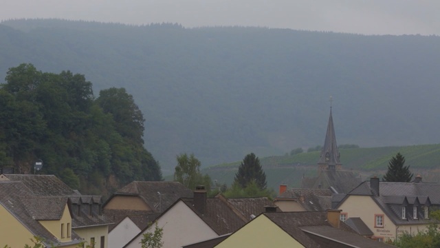 Video Reference: Atmospheric phenomenon, Haze, Hill station, Sky, Roof, Cloud, Rural area, Suburb, Mist, Residential area, Person