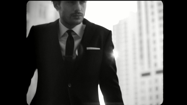 Video Reference: Suit, Photograph, Formal wear, White, Gentleman, Clothing, Male, Tuxedo, Standing, White-collar worker, Person