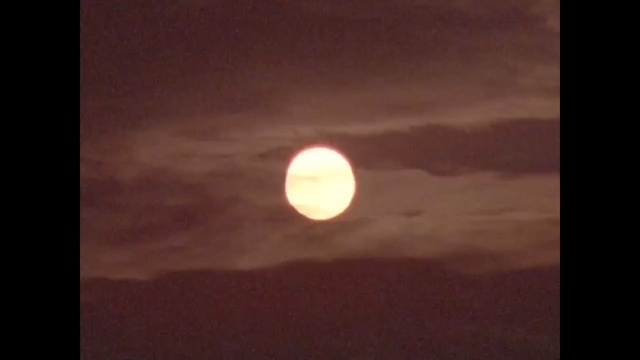 Video Reference: atmosphere, sky, full moon, astronomical object, daytime, moon, night, moonlight, celestial event, midnight, Person