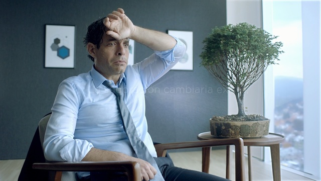 Video Reference: sitting, shoulder, furniture, white collar worker, suit, gentleman, businessperson, window, Person