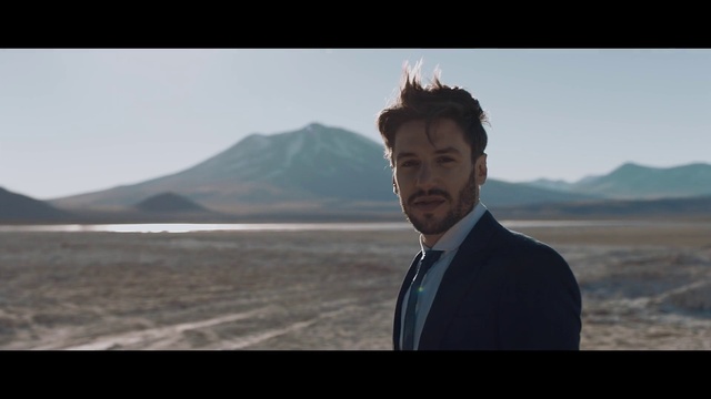 Video Reference: Human, Suit, Screenshot, Landscape, Photography, Horizon, Travel, Formal wear, White-collar worker, Fictional character