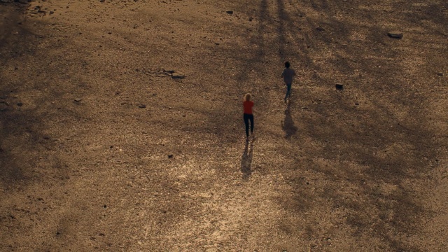 Video Reference: soil, sand, sky, geology, shadow, formation, landscape, rock, ecoregion, grass, Person