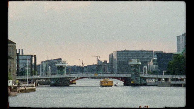 Video Reference: Bridge, City, Metropolitan area, Urban area, Waterway, Human settlement, Skyline, River, Water, Cityscape
