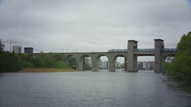 Video Reference: waterway, bridge, river, fixed link, sky, concrete bridge, water, viaduct, canal, skyline