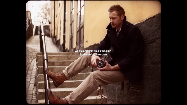 Video Reference: Sitting, Musician, Stock photography, Photography, Guitarist, Music, Person, Man, Holding, Front, Standing, Wearing, Suit, Black, White, Hat, Woman, Ball, Guitar, Text, Clothing, Male