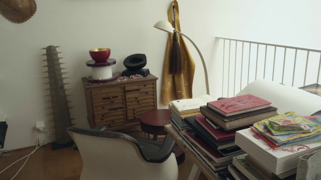 Video Reference: Room, Property, Interior design, Furniture, Home, Table, Living room, House, Floor, Shelf