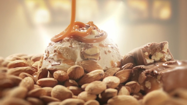 Video Reference: dessert, ice cream, frozen dessert, food, gelato, chocolate, praline, dairy product, sundae, chocolate ice cream, Person