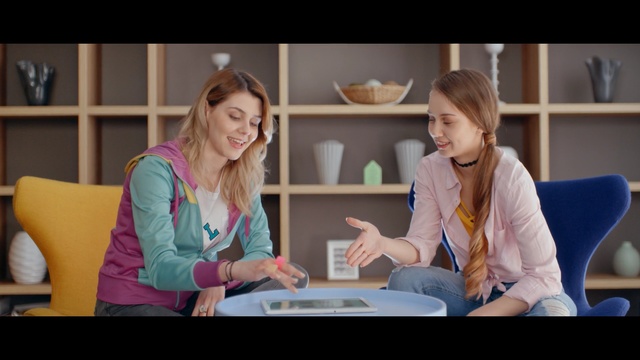 Video Reference: room, girl, sitting, conversation, communication, fun, learning, student, Person