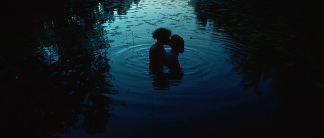 Video Reference: Water, Blue, Reflection, Darkness, River, Fun, Photography, Child, Recreation, Evening, Person, Outdoor, Dark, Swimming, Man, Standing, Looking, Sitting, Sunset, Large, Lake, Light, Holding, Sun, Dog, Body, Yellow, Bird, Red, Boat, Playing, Street, Water sport, Sport