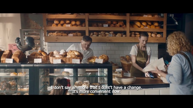 Video Reference: Shopkeeper, Meal, Restaurant, Snack, Food, Fast food restaurant, Chef, Cuisine, Cooking, Customer, Indoor, Person, Man, Photo, Woman, Looking, Kitchen, People, Preparing, Table, Front, Sitting, Counter, Different, Standing, Cake, Group, Fast food, Text, Menu, Pastry, Working