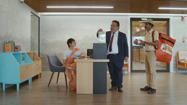 Video Reference: furniture, exhibition, communication, table, floor, art exhibition, Person