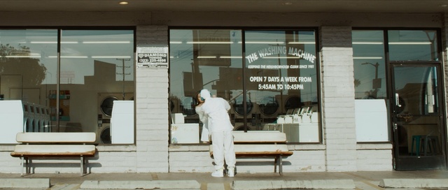 Video Reference: window, display window, building, furniture, door, facade, boutique, glass, interior design, Person