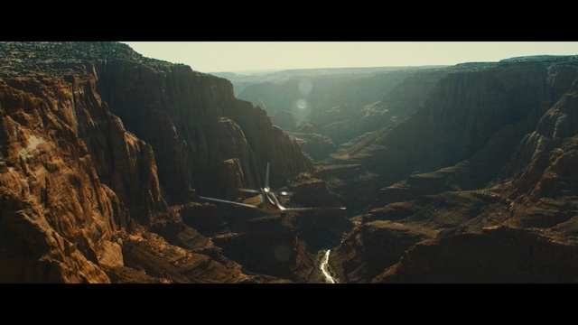 Video Reference: sky, rock, canyon, cliff, escarpment, mountain, terrain, atmosphere, geology, aerial photography