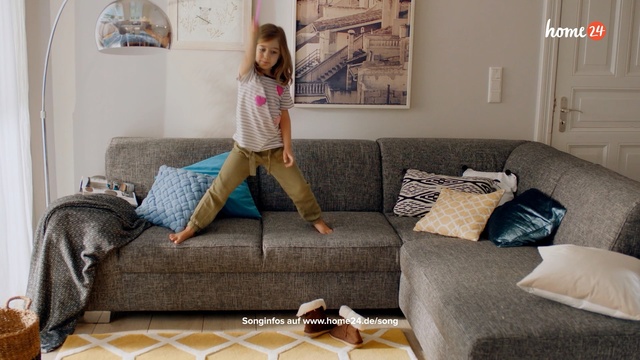 Video Reference: Floor, Furniture, Room, Living room, Couch, Bedroom, Interior design, Flooring, Leg, Bed sheet