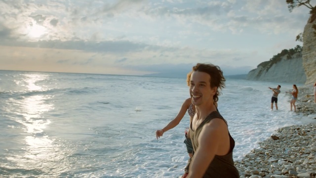 Video Reference: sea, body of water, sky, vacation, beach, ocean, coastal and oceanic landforms, shore, coast, tourism, Person