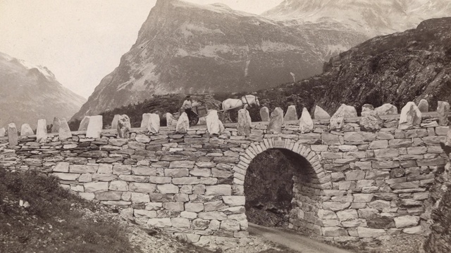 Video Reference: Wall, Mountain, Ruins, Arch bridge, Black-and-white, Mountain range, Stone wall, Devils bridge, Historic site, Architecture
