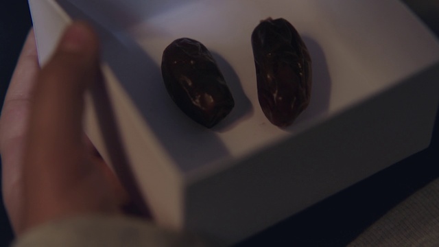 Video Reference: Black, Nail, Finger, Hand, Material property, Technology, Electronic device, Chocolate