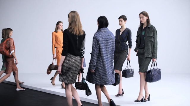 Video Reference: Fashion, Fashion model, Clothing, Fashion design, Standing, Runway, Street fashion, Outerwear, Design, Footwear, Person