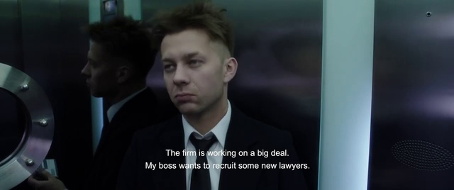 Video Reference: Suit, White-collar worker, Gentleman, Formal wear, Businessperson, Tuxedo, Photo caption, Official, Speech, Spokesperson, Person, Man, Indoor, Looking, Front, Photo, Holding, Monitor, Standing, Wearing, Screen, Sitting, Woman, Table, Young, Computer, Phone, Black, Laptop, Mirror, Desk, White, Wedding, Video, Room, Screenshot, Human face, Tie, Clothing