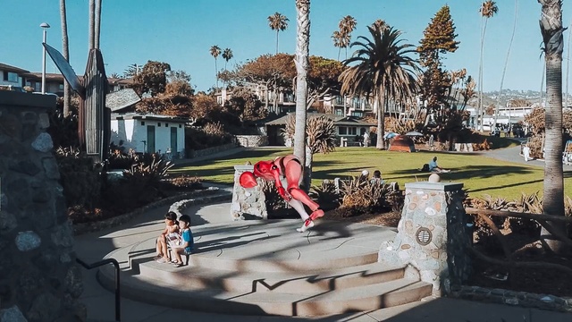 Video Reference: recreation, tree, city, vehicle, plaza, outdoor structure, sky