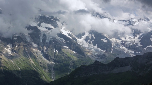 Video Reference: Mountainous landforms, Mountain, Highland, Mountain range, Sky, Nature, Ridge, Alps, Cloud, Hill station