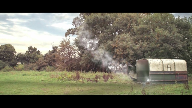 Video Reference: tree, rural area, grass, vehicle, field, pasture, smoke, landscape, farm, sky